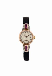 LONGINES - LONGINES, elegante orologio da polso, da signora, in oro rosa 18K con rubini e brillanti. Realizzato nel 1920 circa