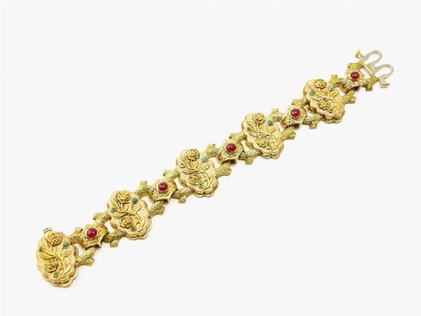Bracciale in oro giallo e rosa, rubini e turchesi  - Asta Importanti Gioielli e orologi - Associazione Nazionale - Case d'Asta italiane