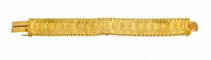BRACCIALE - Peso gr 28 7 Lunghezza cm 17 in oro giallo  inizi XX secolo  composto da segmenti sagomati lucidi alternati a  [..]