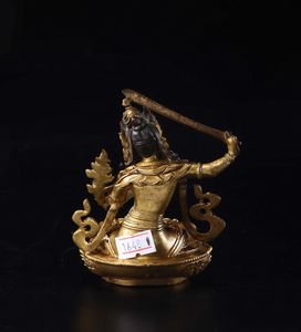 Figura di Manjushri seduto su fiore di loto in bronzo dorato, Tibet, XVII secolo  - Asta Fine Chinese Works of Art - Associazione Nazionale - Case d'Asta italiane