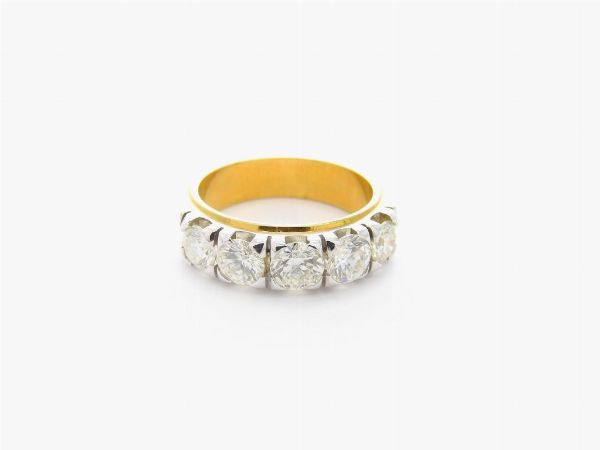 Anello rivire in oro giallo e bianco con diamanti  - Asta Gioielli - II - Associazione Nazionale - Case d'Asta italiane