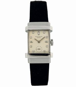 PATEK PHILIPPE - PATEK PHILIPPE, Genve, Ref. 1450. Raro, orologio da polso, di forma rettangolare, in platino e quadrante in brillanti. Realizzato nel 1950 circa