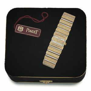 Piaget - PIAGET, Polo,  Ref. 8131 C 725. Raro, orologio da polso, due ori, bianco e giallo con brillanti, al quarzo, con bracciale in oro integrato. Accompagnato da una scatola , portafoglio e listino prezzi originale. Realizzato nel 1980 circa