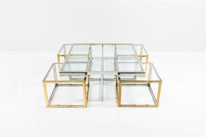 REGA ROMEO - Serie di tavolini ad incastro in metallo cromato e ottone  piani in vetro. Anni '70 cm 44x104x104