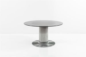 RINALDI GASTONE - Tavolo con struttura in metallo cromato  piano in vetro fum. Prod. RIMA anni '70 cm 73x130