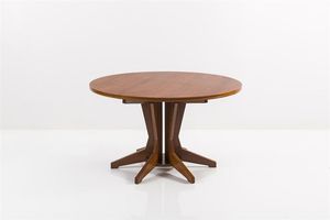 ALBINI FRANCO - Tavolo in legno di noce  piano sorretto da un sistema di gambe costituite da elementi radiali. Prod. Succ. Carlo  [..]