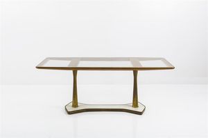 DASSI - Tavolo con sostegni in bronzo raccordati da base in marmo bianco  piano in cristallo incorniciato da listelli  [..]