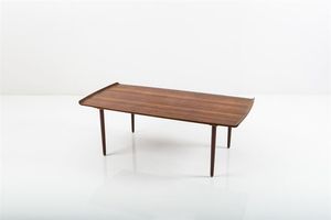 OLSEN KURT - Tavolino in legno di teak. Anni '50 Etichetta del produttore cm 48x137x69 Bibl.: Charlotte & Peter Fiells  Decorative  [..]