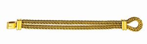POMELLATO - Peso gr 84 Lunghezza cm 20 Bracciale in oro giallo  a laccio  lavorato a doppia maglia a corda  firmato Pomell [..]