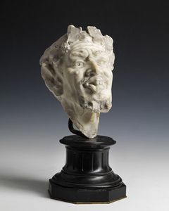ARTISTA DEL XVIII SECOLO - Testa di fauno in marmo scolpito.