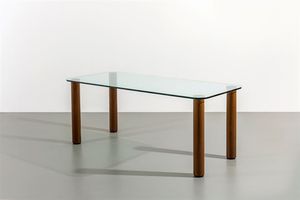 MARCO ZANUSO - Tavolo con piano in cristallo  sostegni in acciaio e legno. Prod. Zanotta fine anni '60 cm 72x180x80