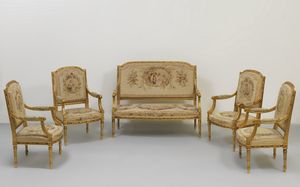MANIFATTURA ITALIANA DEL XX SECOLO - Quattro poltrone e un divanetto in stile Luigi XVI, con tappezzeria antica a piccolo punto, raffigurante scene galanti e paesaggi.