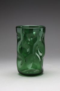 VETRERIE DI EMPOLI - Vaso in vetro trasparente color verde decorato da depressioni sulla superficie, anni '50.
