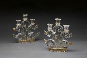 BAROVIER ERCOLE (1889 - 1974) - Coppia di candelabri in vetro trasparente con inclusione di bolle e foglia oro. Anni Trenta.