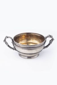 FABERGE' - Peso gr 265 7 Diam. 10 Coppa in argento  di forma circolare  decorata da fasce a motivi cordonati; doppio manico  [..]