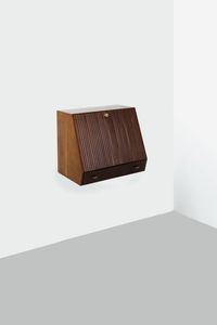 OSVALDO BORSANI  attribuito - Mobile sospeso in legno di noce con anta a ribalta grissinata a creare il piano di uno scrittoio. Anni '50 cm  [..]