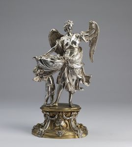 ARGENTIERE ANGELO SPINAZZI  (1693 - 1767) - Acquasantiera in argento a forma di angelo con putto reggente una conchiglia.