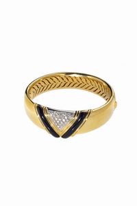 BRACCIALE - Peso gr 60 2 rigido  in oro giallo  al centro inserto geometrico con diamanti taglio brillante per totali ct 1  [..]