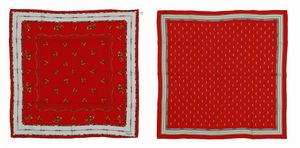 CELINE - Coppia di foulard in seta su base rossa.