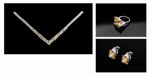 BURMA - Parure in argento e pietre dure sintetiche (burmalite) bianche e gialle, composta da collana,coppia di orecchini e anello.