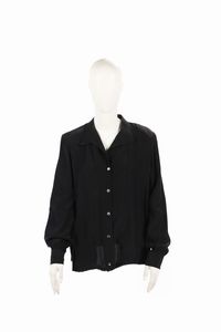 DIOR CHRISTIAN (1905 - 1957) - Camicia in seta nera , chiusura con bottoni e maniche a sbuffo.Fine Anni 80 inizi anni 90. Taglia 44IT.