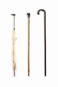 ARGENTIERE DEL XIX SECOLO - Due bastoni con manico in argento e un ombrellino.