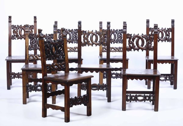 Otto sedie in noce intagliato, XIX secolo  - Asta Arredi | Cambi Time - Associazione Nazionale - Case d'Asta italiane