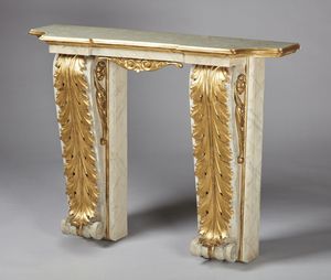 MANIFATTURA DEL XIX-XX SECOLO - Consolle in stile Impero in legno scolpito, parzialmente dorato e laccato.