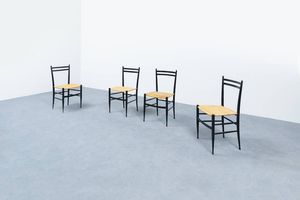 PRODUZIONE ITALIANA - Quattro sedie chiavarine in legno ebanizzato  seduta in paglia di Vienna. Anni '50 cm 83x41 5x35