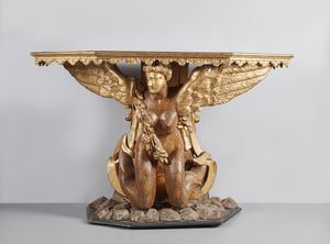 MANIFATTURA ROMANA DEL XVII-XVIII SECOLO - Tavolo da parete in legno scolpito e dorato con sostegno in forma di sirena alata e bicaudata.