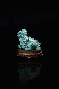 FIGURA DI GUANYIN - Figura in turchese di Guanyin in posizione seduta  Cina  Repubblica  XX secolo. h cm 10x8 5