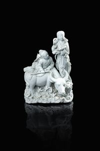 GRUPPO IN PORCELLANA - Gruppo in porcellana Blanc de Chine rappresentante due figure con bufalo  Cina  dinastia Qing  XX secolo. h cm  [..]