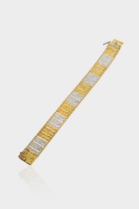 BRACCIALE - Peso gr 20 2 Lunghezza cm 19 in oro giallo e bianco  inizi XX secolo  composto da segmenti rigidi incisi e sat [..]