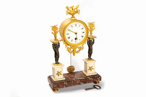 Pendola da tavolo in marmo e bronzo dorato, in stile Luigi XVI  - Asta Incanti d'Arte - Associazione Nazionale - Case d'Asta italiane
