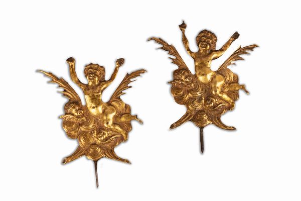 Due placche in bronzo dorato raffiguranti putti e cherubini, secolo XVII  - Asta Incanti d'Arte - Associazione Nazionale - Case d'Asta italiane