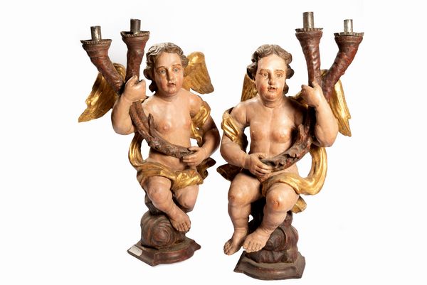 Coppia di angeli reggi cero in legno laccato e dorato, secolo XVII  - Asta Incanti d'Arte - Associazione Nazionale - Case d'Asta italiane