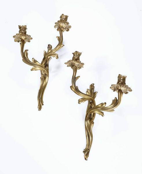 Coppia di appliques in bronzo dorato a due luci  - Asta Antiquariato Febbraio | Cambi Time - Associazione Nazionale - Case d'Asta italiane