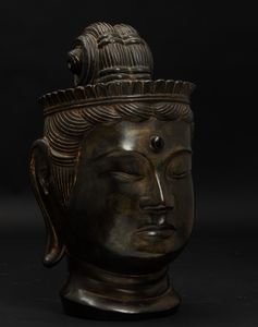 Testa di Buddha in bronzo con tracce in doratura, Cina, XX secolo  - Asta Arte Orientale | Cambi Time - Associazione Nazionale - Case d'Asta italiane