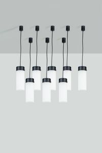 STILNOVO - Serie di otto lampade a sospensione con struttura in metallo verniciato  diffusori in vetro opalino. Anni '50  [..]